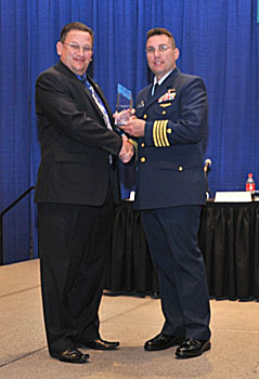USCG CAPT LeBlanc (right) receives the 2012 Legacy Award from Task Force Member Scott Schaefer 