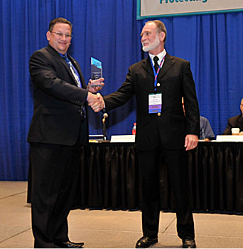 Rusty Nall (right) receives the 2012 Legacy Award from Task Force Member Scott Schaefer 