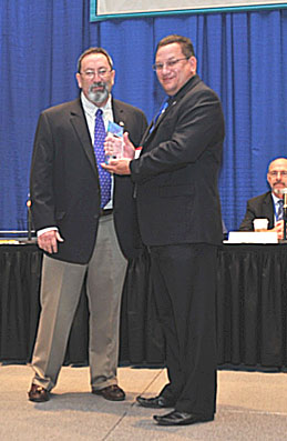 General Manager David Owings(left) accepts the Legacy Award  for SEAPRO from Task Force Member Scott Schaefer